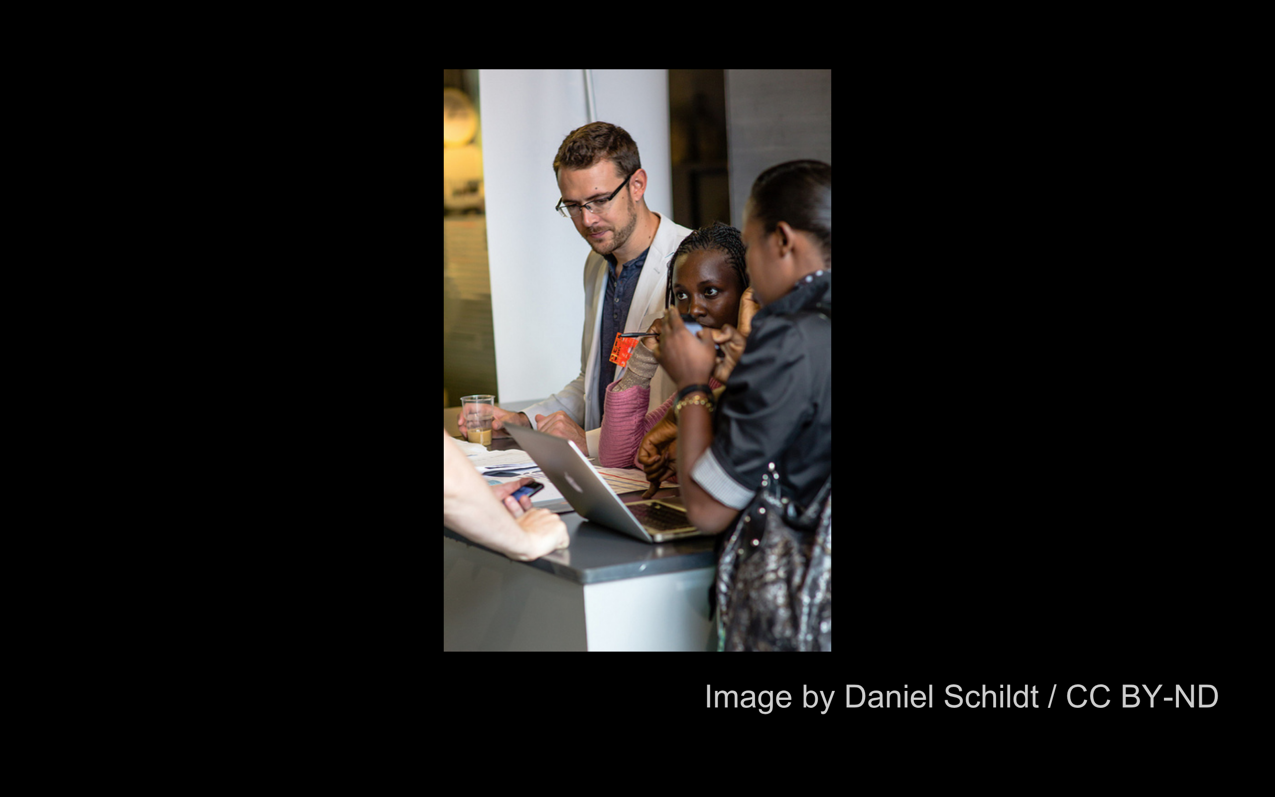 Billy at reception desk of OKfest